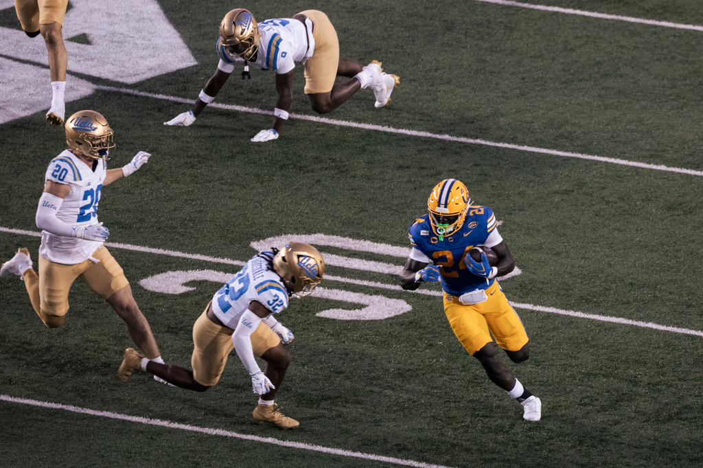 California running back Adam Mohammed (24) rushes up the field during the first half of an NCAA football game against UCLA in Berkeley, Calif., on Saturday, Sept. 5, 2026. (Stephen Lam/San Francisco Chronicle via AP)