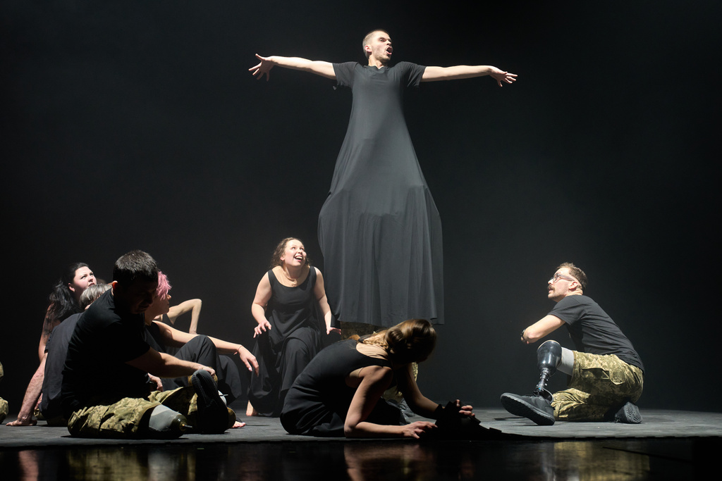 Ukrainian war veterans, many of whom sustained severe injuries in combat during Russia's full-scale invasion of Ukraine, perform during a premiere on Thursday, Feb. 19, 2026, in Kyiv, Ukraine. (AP Photo/Efrem Lukatsky)
