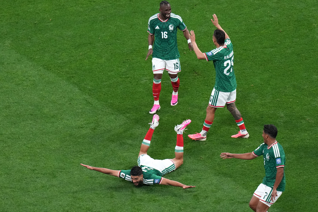 Mexico's Raul Jimenez (9) celebrates with teammates after scoring their second goal during the World Cup round of 32 soccer match between Mexico and Ecuador in Mexico City, Tuesday, June 30, 2026. (AP Photo/Silvia Izquierdo)