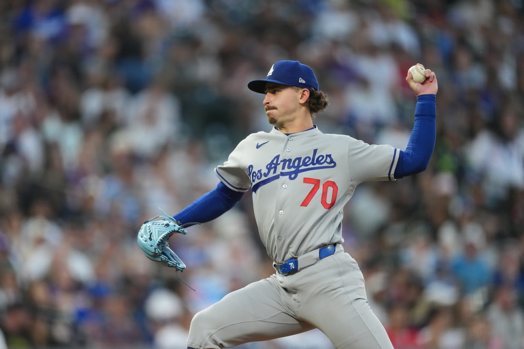 Los Angeles Dodgers starting pitcher Justin Wrobleski works against the Colorado Rockies in the third inning of a baseball game Monday, April 20, 2026, in Denver. (AP Photo/David Zalubowski)