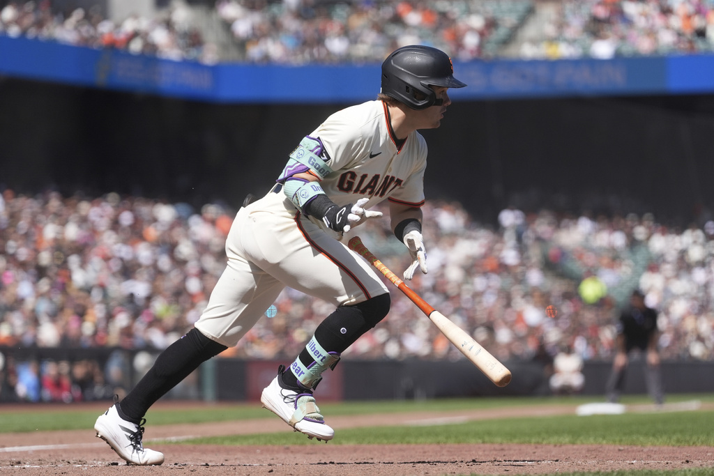 San Francisco Giants' Drew Gilbert runs to first base on his RBI single during the eighth inning of a baseball game against the Tampa Bay Rays in San Francisco, Sunday, Aug. 17, 2025. (AP Photo/Jeff Chiu)