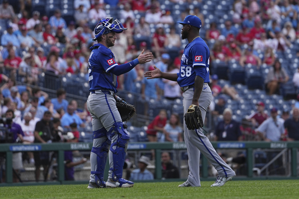 Kansas City Royals pitcher Luinder Avila (58) and catcher Carter Jensen, left, celebrate after their team won a baseball game against the Philadelphia Phillies, Sunday, Sept. 14, 2025, in Philadelphia. (AP Photo/Matt Rourke)