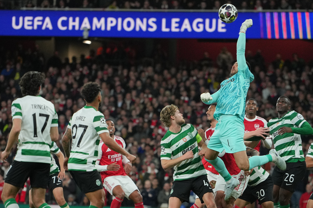 Sporting's goalkeeper Rui Silva punches the ball during the UEFA Champions League second leg quarterfinal soccer match between Arsenal and Sporting in London, England, Wednesday, April 15, 2026. (AP Photo/Kin Cheung)