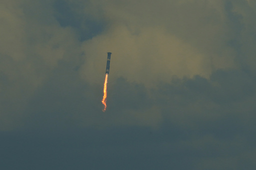 SpaceX's mega rocket booster returns to the gulf during a test flight from Starbase, Texas, Monday, Oct. 13, 2025. (AP Photo/Eric Gay) SpaceX's mega rocket booster returns to the gulf during a test flight from Starbase, Texas, Monday, Oct. 13, 2025. (AP Photo/Eric Gay)