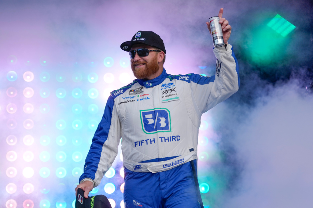 Chris Buescher waves to fans during driver introductions before a NASCAR Cup Series auto race at Daytona International Speedway, Saturday, Aug. 29, 2026, in Daytona Beach, Fla. (AP Photo/John Raoux)
