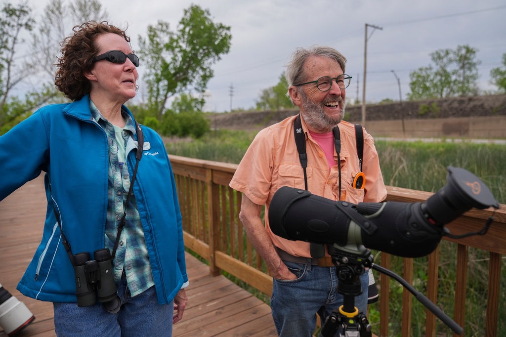 Birders Pat and Steve Pearson visit Park No. 597, where a pair of bald eagles are raising two eaglets, on the south side of Chicago, Tuesday, May 12, 2026. (AP Photo/Erin Hooley)