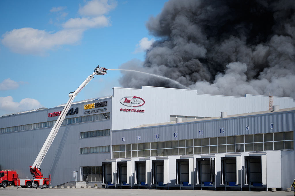 Firefighters put out a fire at warehouse stores after a Russian air attack in Kyiv, Ukraine, Wednesday, Sept. 2, 2026. (AP Photo/Efrem Lukatsky)