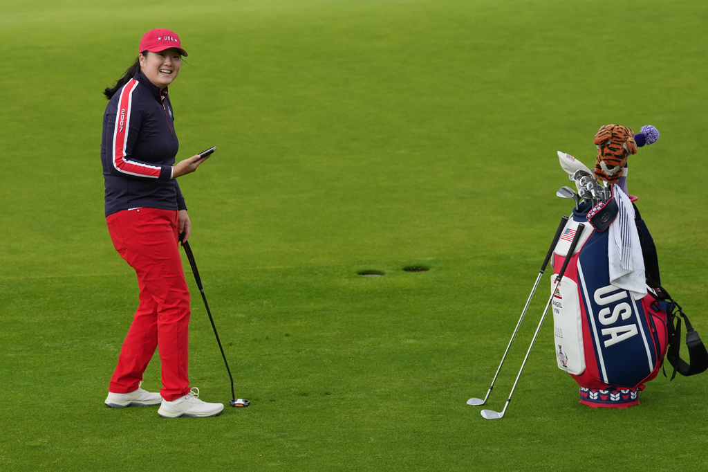 Angel Yin of the United States reacts to comments from supporters as she prepares to chip onto the 6th green during a practice round for the Solheim Cup at the Bernardus Golf course in Vught, Netherlands, Wednesday, Sept. 9, 2026. (AP Photo/Alastair Grant)