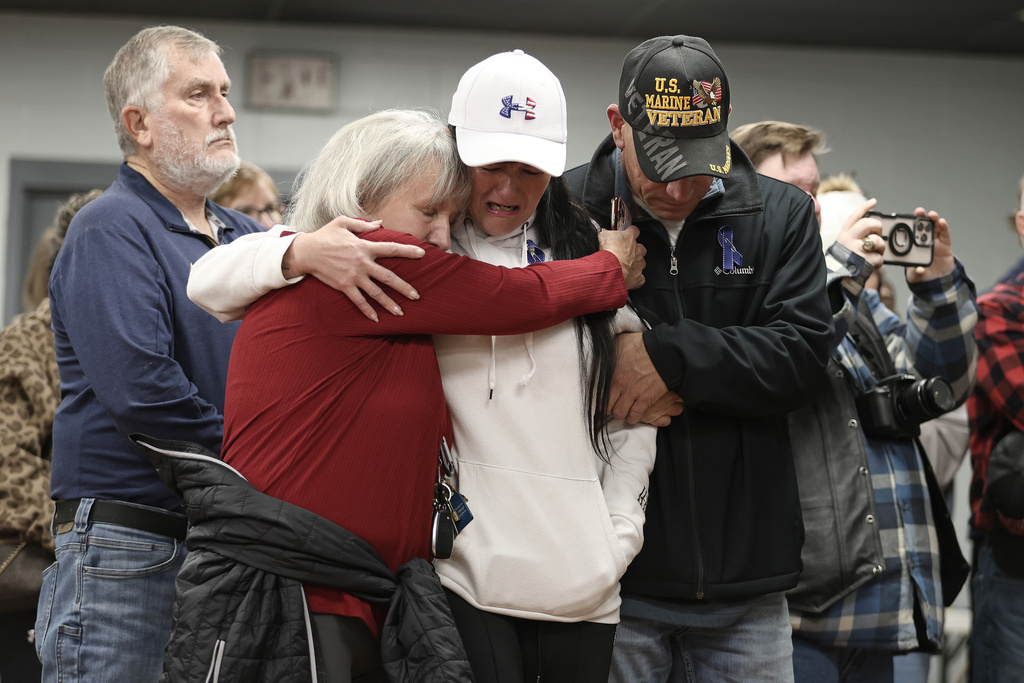 People gather for a vigil in honor of National Guard member Specialist Sarah Beckstrom, one of two National Guard members who were shot in Washington on Wednesday, in Webster Springs, W.Va., Friday, Nov. 28, 2025. (AP Photo/Kathleen Batten)