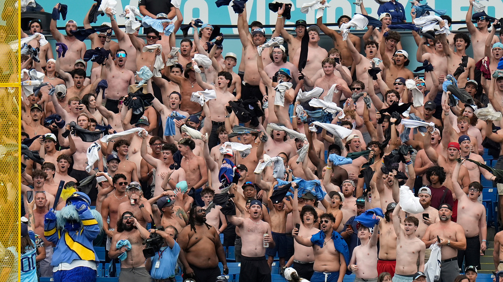 Tampa Bay Rays fans take part in the "tarp off" during the seventh inning of a baseball game against the Baltimore Orioles Wednesday, May 20, 2026, in St. Petersburg, Fla. (AP Photo/Chris O'Meara)