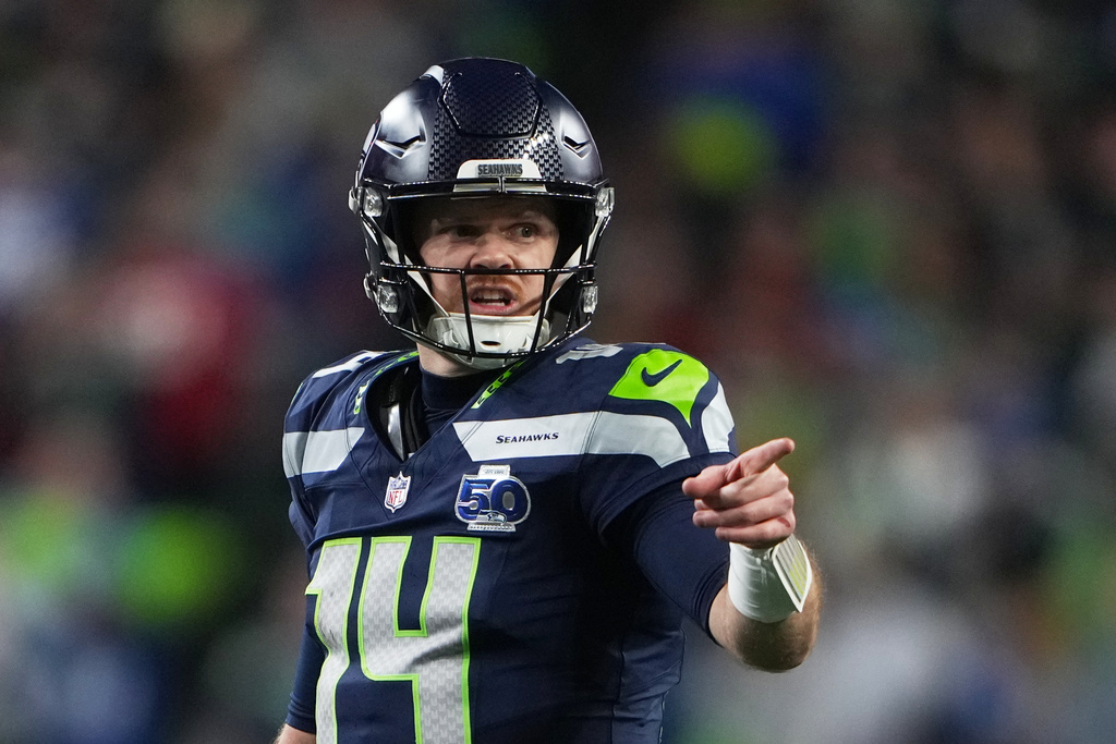 Seattle Seahawks quarterback Sam Darnold reacts during the second half of an NFL football divisional playoff game against the San Francisco 49ers, Saturday, Jan. 17, 2026, in Seattle. (AP Photo/Lindsey Wasson)
