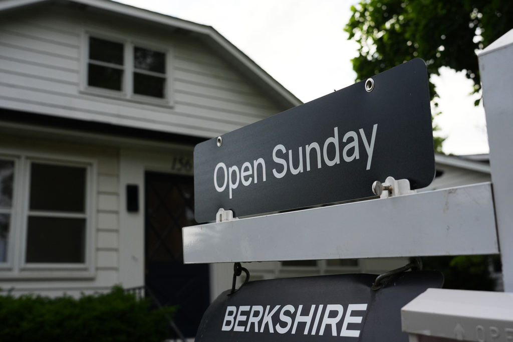 Information sign about open house for home sale is seen outside of a home in Wheeling, Ill., Monday, June 8, 2026. (AP Photo/Nam Y. Huh)