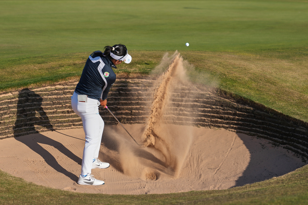 Jeeno Thitikul, of Thailand, plays a shot out of a bunker on the 17th green during the third round of the Women's British Open golf championship in Lytham St Annes, England, Saturday, Aug. 1, 2026. (AP Photo/Jon Super)