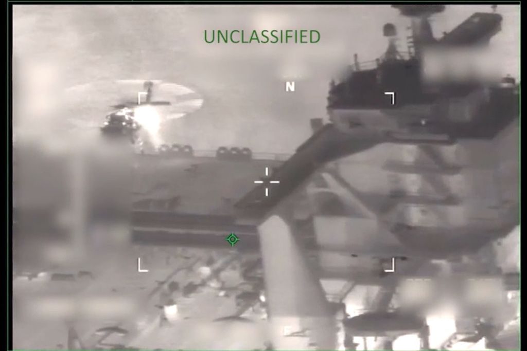 This image from video provided by the U.S. Department of Defense, shows U.S. forces boarding the M/T Sophia in the Caribbean Sea early Wednesday, Jan. 7, 2026. (Department of Defense via AP)