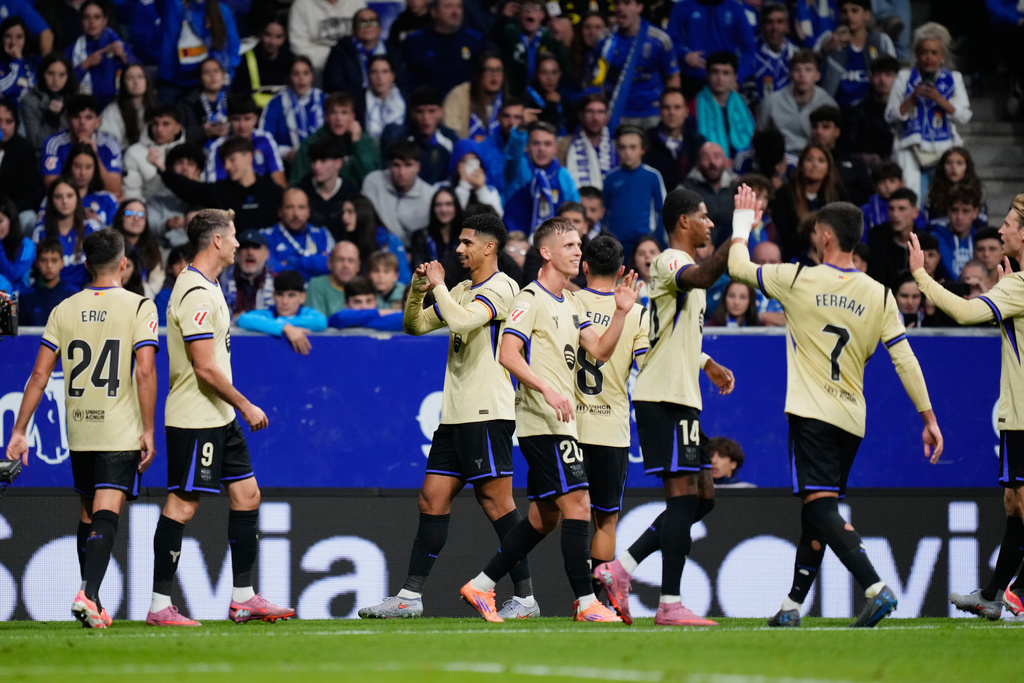 Barcelona's Ronald Araujo celebrates his side's third goal during a Spanish La Liga soccer match at the Carlos Tartiere stadium in Oviedo, Spain, Thursday, Sept. 25, 2025. (AP Photo/Jose Breton)