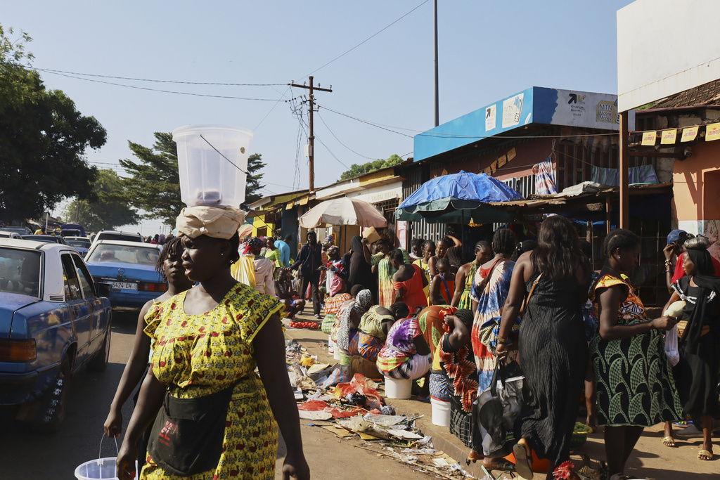 People shop at a market in Bissau, Guinea-Bissau, Friday, Nov. 28, 2025. (AP Photo/Darcicio Barbosa)