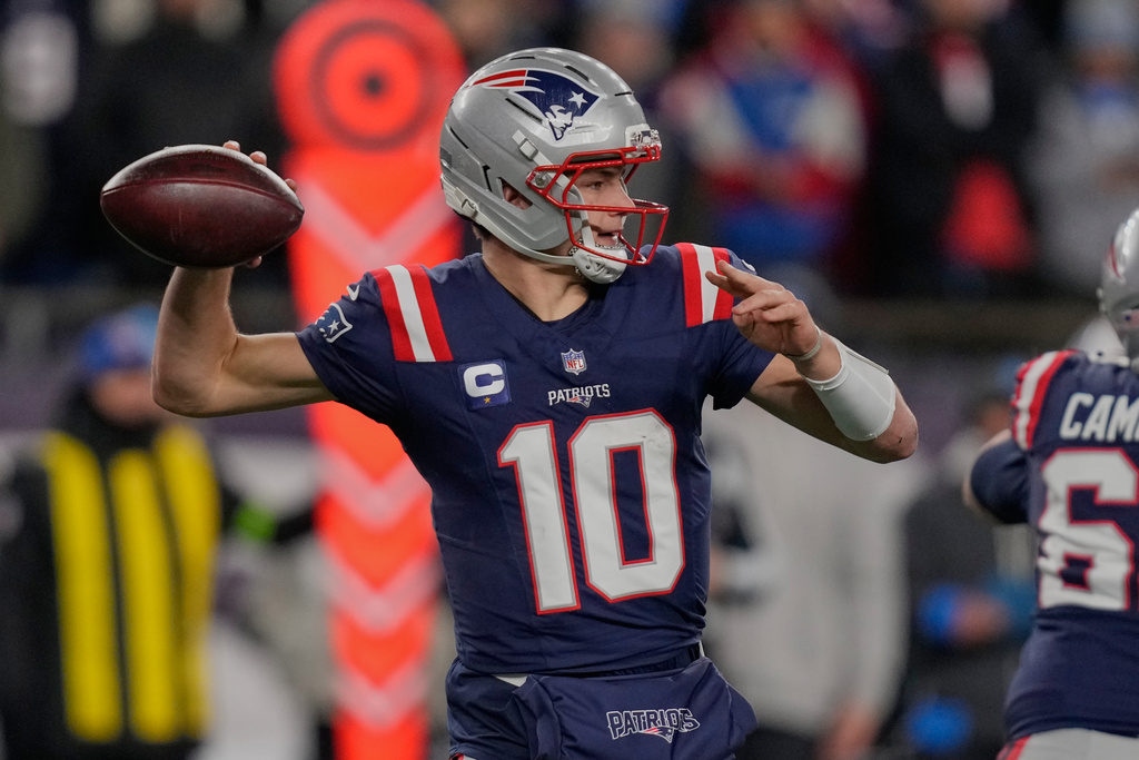 New England Patriots quarterback Drake Maye (10) passes in the first half of an NFL wild-card playoff football game against the Los Angeles Chargers, in Foxborough, Mass., Sunday, Jan. 11, 2026. (AP Photo/Charles Krupa)