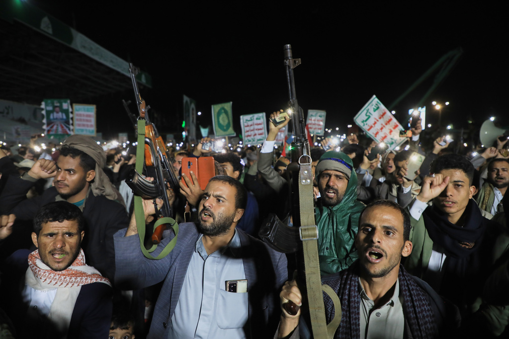 Supporters of Yemen’s Houthi rebels chant and raise rifles during a rally organized to celebrate the group’s capture of Mayun Island in the strategic Bab el-Mandeb Strait, in Houthi-controlled Sanaa, Yemen, Friday, Sept. 11, 2026. (AP Photo/Osamah Abdulrahman)