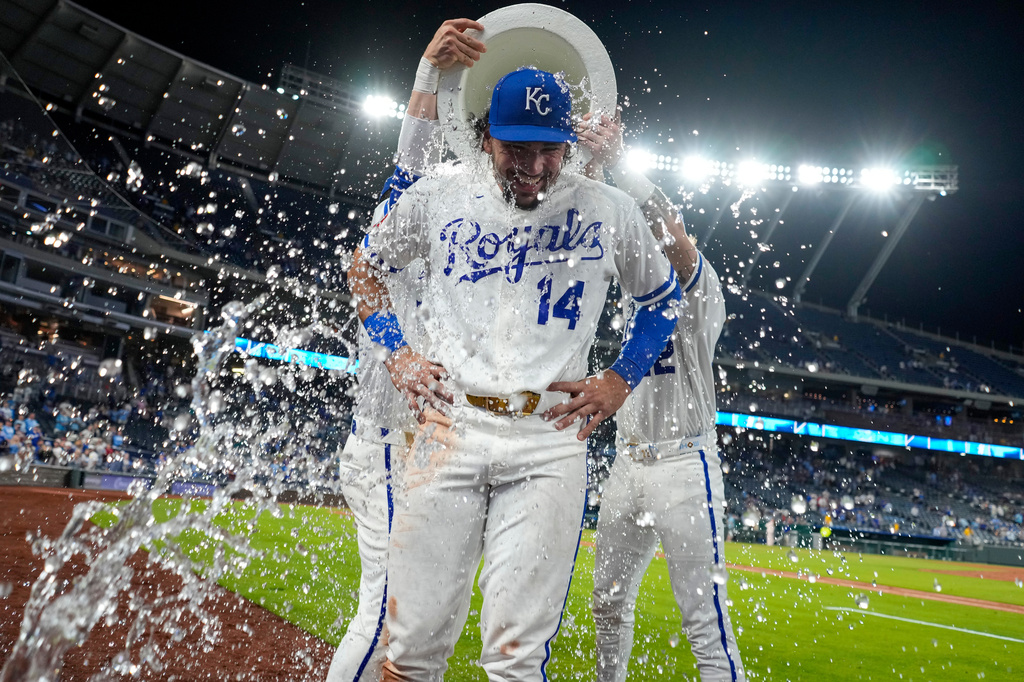 Kansas City Royals' Jac Caglianone (14) is doused by teammates after their baseball game against the Cleveland Guardians, Monday, May 4, 2026, in Kansas City, Mo. (AP Photo/Charlie Riedel)