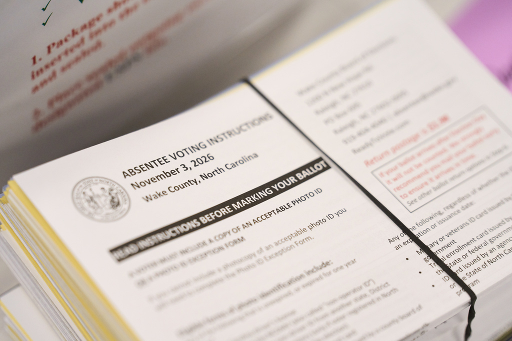 Absentee voting instructions for mail-in ballots are seen at the Wake County Board of Elections on Thursday, Sept. 3, 2026, in Raleigh, N.C. (AP Photo/Matt Ramey)