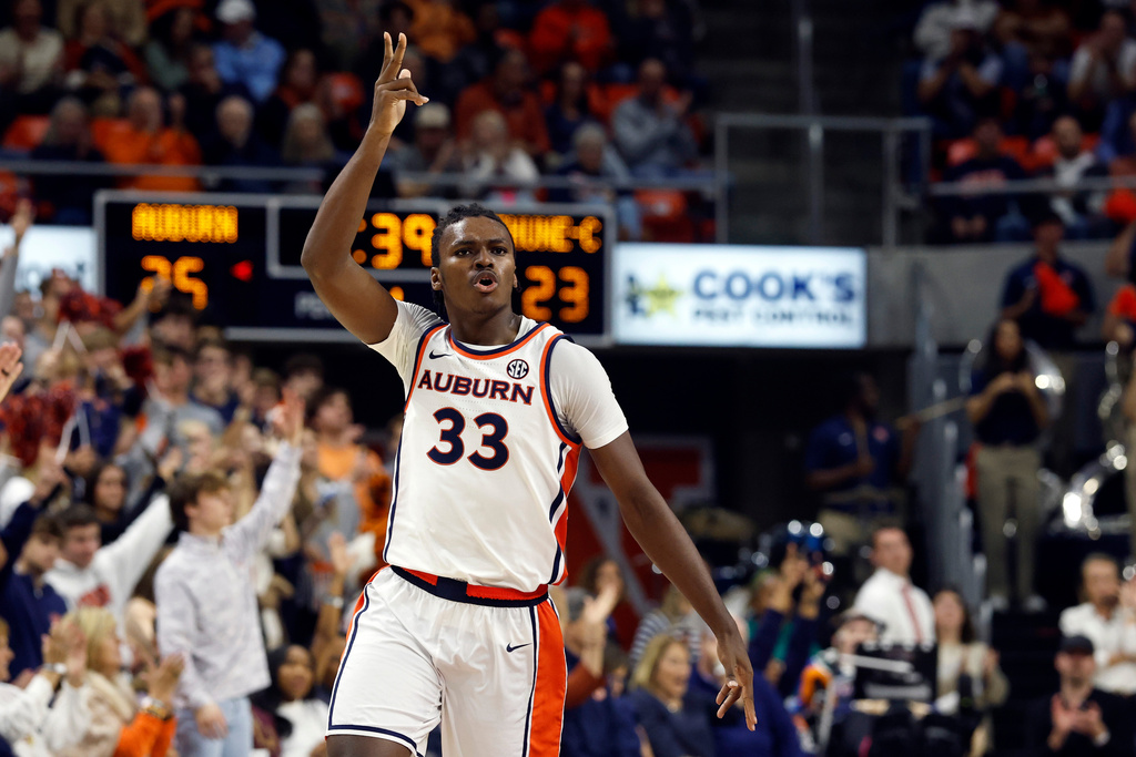 Auburn forward Sebastian Williams-Adams reacts after making a three-point shot against Bethune-Cookman during the first half of an NCAA college basketball game, Monday, Nov. 3, 2025, in Auburn, Ala. (AP Photo/Butch Dill)