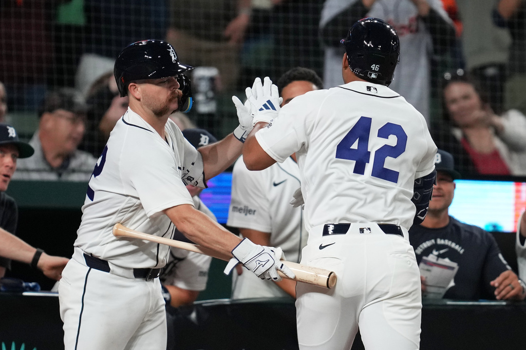 Detroit Tigers' Wenceel Pérez, right, celebrates his home run with Jake Rogers, left, during the eighth inning of a baseball game against the Kansas City Royals Wednesday, April 15, 2026, in Detroit. (AP Photo/Paul Sancya)