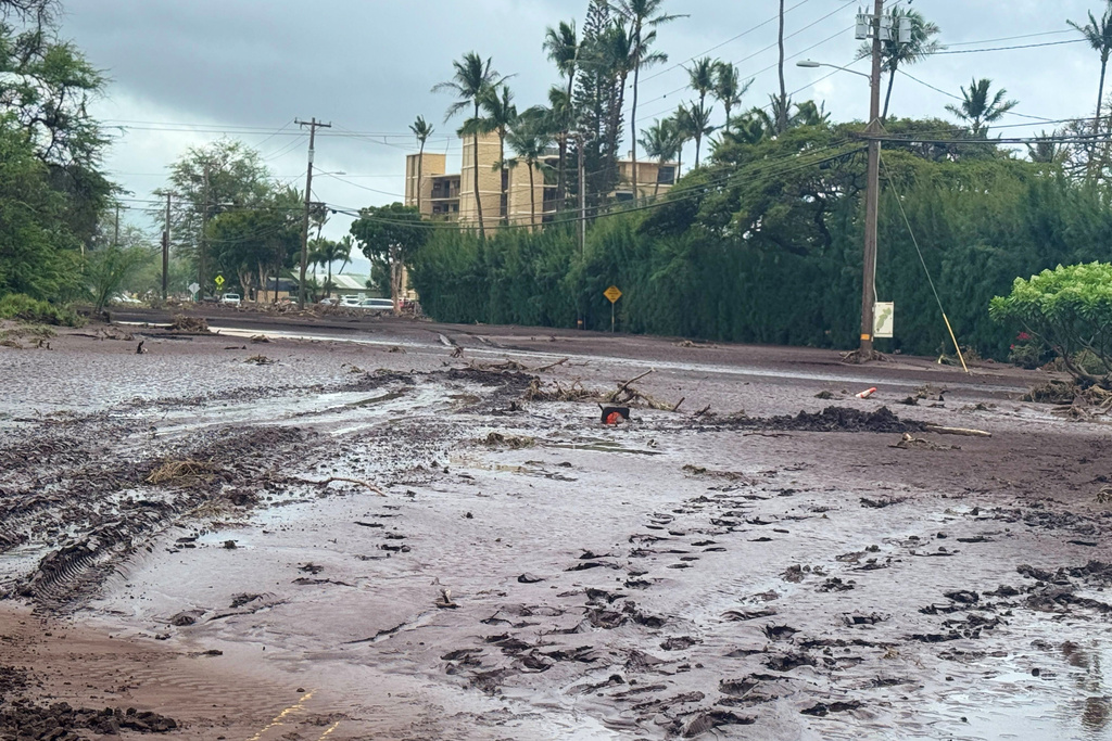 Mud is covers a street following heavy rains and flooding on the island of Maui, Sunday, March 15, 2026, in the community of North Kihei, Hawaii. (Athena Walsh via AP)