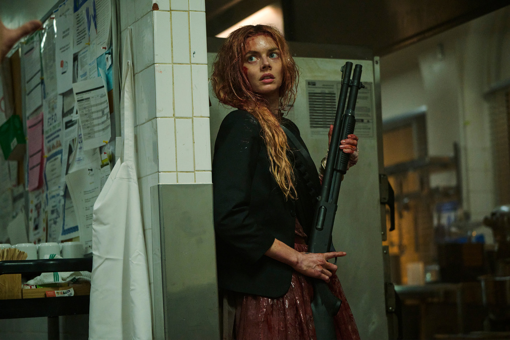 This image released by Searchlight Pictures shows Samara Weaving in a scene from "Ready or Not 2: Here I Come." (Pief Weyman/Searchlight Pictures via AP)