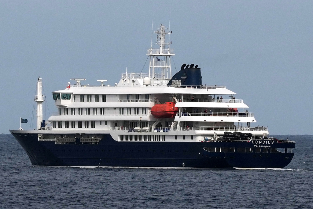 The MV Hondius cruise ship departs the port in Praia, Cape Verde, Wednesday, May 6, 2026. (AP Photo/Misper Apawu)