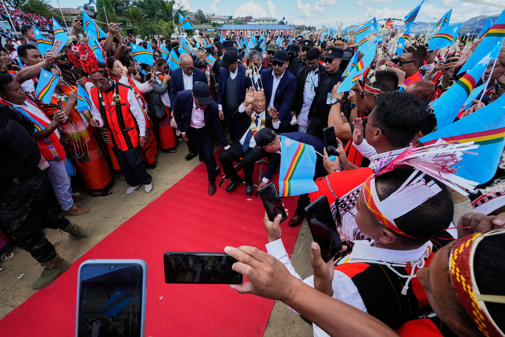 People greet Thuingaleng Muivah, leader of the National Socialist Council of Nagaland (Isak-Muivah), as he arrives in Ukhrul, in the northeastern Indian state of Manipur, Wednesday, Oct. 22, 2025. (AP Photo/Anupam Nath)