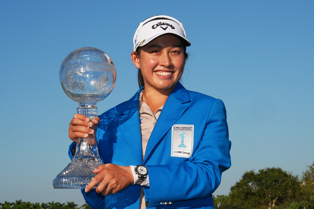 Jeeno Thitikul of Thailand holds the CME Global Trophy after winning the LPGA Tour Championship golf tournament, Sunday, Nov. 23, 2025, in Naples, Fla. (AP Photo/Marta Lavandier)