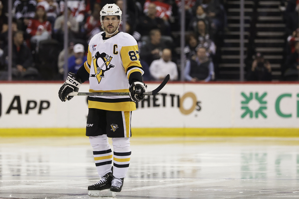 FILE - Pittsburgh Penguins center Sidney Crosby (87)waits for the the third period of an NHL hockey game against the New Jersey Devils, April 11, 2025, in Newark, N.J. (AP Photo/Adam Hunger, file)