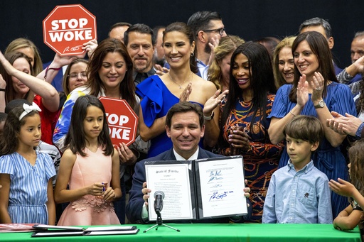 FILE - Florida Gov. Ron DeSantis smiles after publicly signing HB7, also known as the "stop woke" bill, during a news conference at Mater Academy Charter Middle/High School in Hialeah Gardens, Fla., on April 22, 2022. (Daniel A. Varela/Miami Herald via AP, File) FILE - Florida Gov. Ron DeSantis smiles after publicly signing HB7, also known as the "stop woke" bill, during a news conference at Mater Academy Charter Middle/High School in Hialeah Gardens, Fla., on April 22, 2022. (Daniel A. Varela/Miami Herald via AP, File)