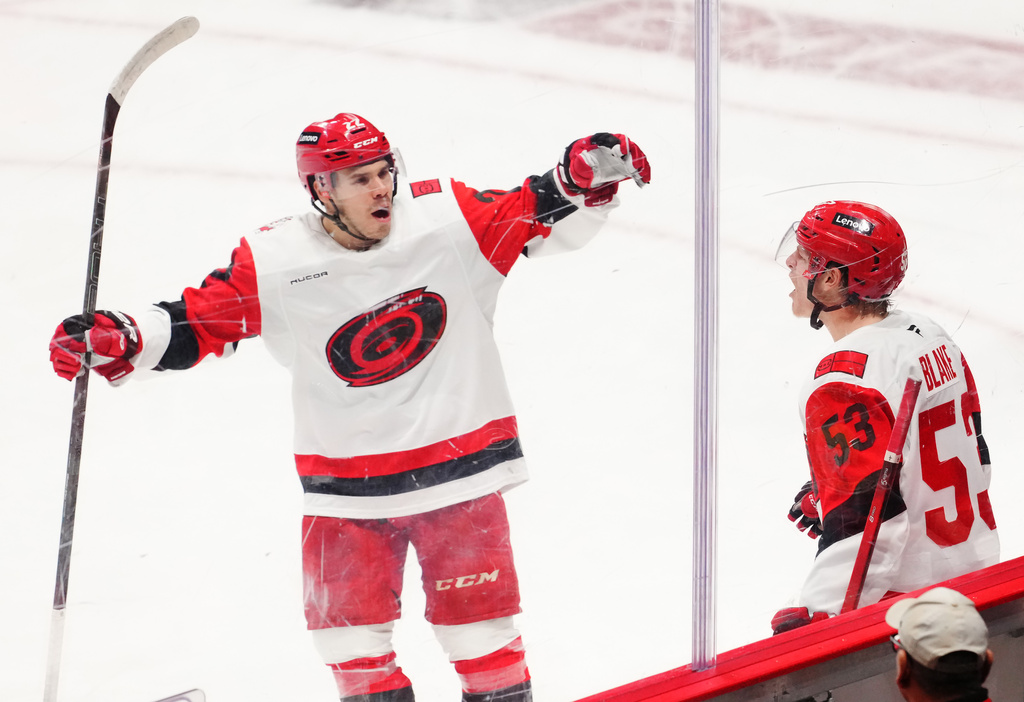 Carolina Hurricanes' Jackson Blake (53) celebrates his goal against the Ottawa Senators with Logan Stankoven (22) during the second period of an NHL hockey playoff game in Ottawa, Ontario, Thursday, April 23, 2026. (Sean Kilpatrick/The Canadian Press via AP)