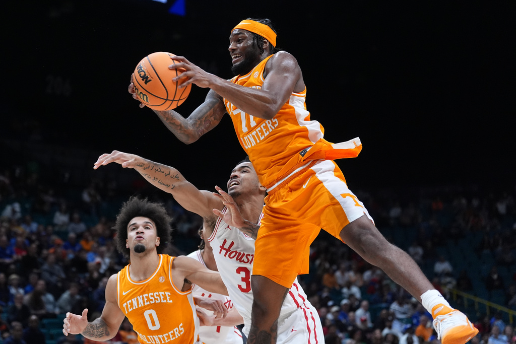Tennessee guard Amaree Abram (77) grabs a rebound over Houston guard Ramon Walker Jr. (3) during the first half of an NCAA college basketball game in the Players Era tournament Las Vegas, Tuesday, Nov. 25, 2025. (AP Photo/Eric Gay)