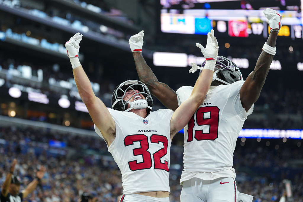 Atlanta Falcons running back Cash Jones (32) celebtes his touchdown with wide receiver Chris Blair (19) against the Indianapolis Colts during the first half of an NFL football game in Indianapolis, Saturday, Aug. 22, 2026. (AP Photo/AJ Mast)