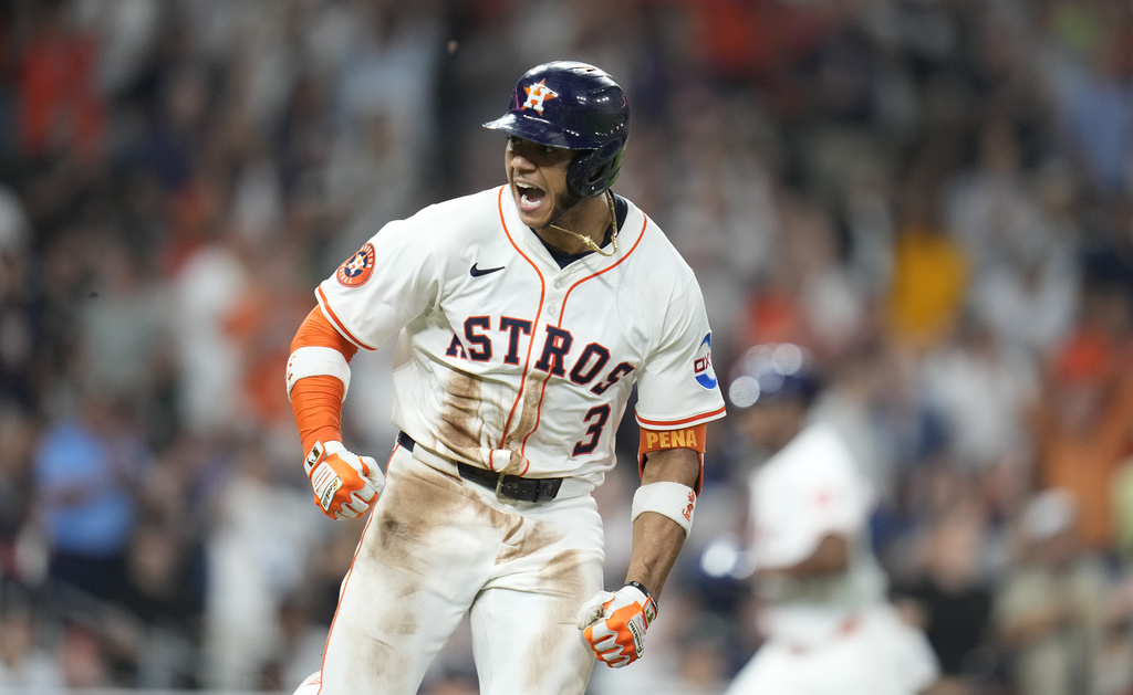 Houston Astros' Jeremy Peña (3) reacts after his RBI single against New York Yankees relief pitcher Camilo Doval during the eighth inning of a baseball game Wednesday, Sept. 3, 2025, in Houston. (AP Photo/Karen Warren)