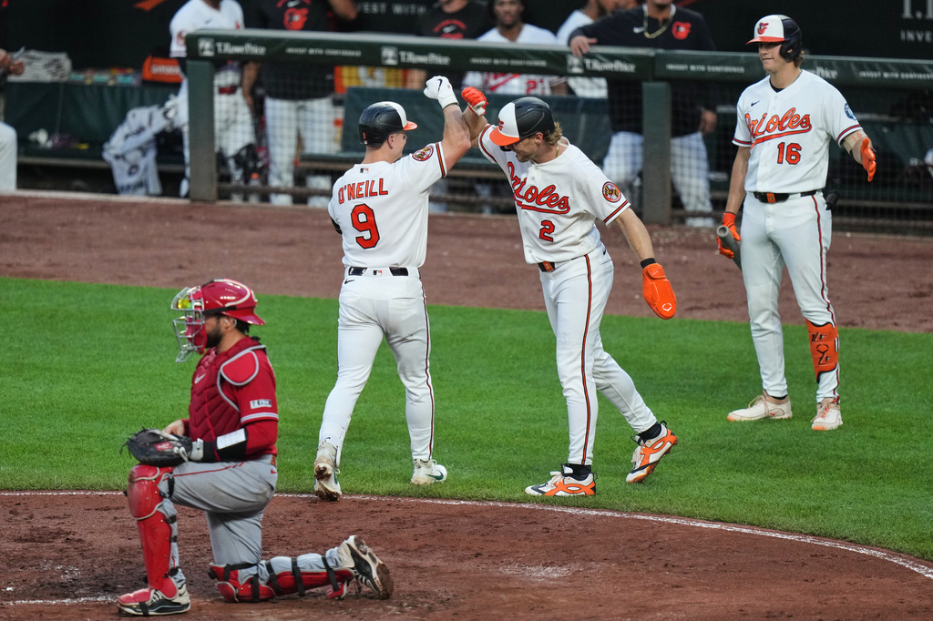Baltimore Orioles' Tyler O'Neill (9) celebrates with Gunnar Henderson (2) after hitting a two-run home run during the fourth inning of a baseball game against the Los Angeles Angels, Wednesday, Aug. 5, 2026, in Baltimore. (AP Photo/Stephanie Scarbrough)