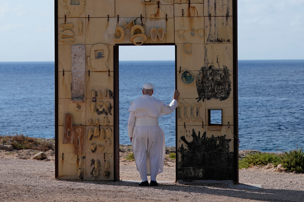 Pope Leo XIV visits the Gateway of Europe monument in Lampedusa, Sicily, southern Italy, Saturday, July 4, 2026, during a one-day pastoral visit to the island long associated with the plight of migrants crossing the Mediterranean. (AP Photo/Alessandra Tarantino)