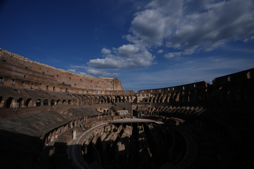 FILE - Sunlight illuminates the Colosseum in Rome, Friday, April 3, 2026. (AP Photo/Alessandra Tarantino, File)