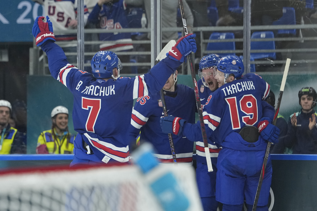 United States' Jack Eichel, second right, celebrates after scoring his side's third goal during a preliminary round match of men's ice hockey between United States and Denmark at the 2026 Winter Olympics, in Milan, Italy, Saturday, Feb. 14, 2026. (AP Photo/Petr David Josek)