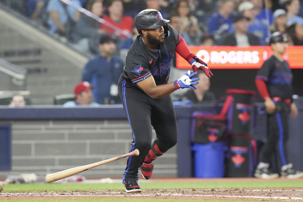 Toronto Blue Jays' Vladimir Guerrero Jr. doubles against the Baltimore Orioles during fifth inning MLB baseball action in Toronto, Friday Sept. 12, 2025. (Chris Young/The Canadian Press via AP)