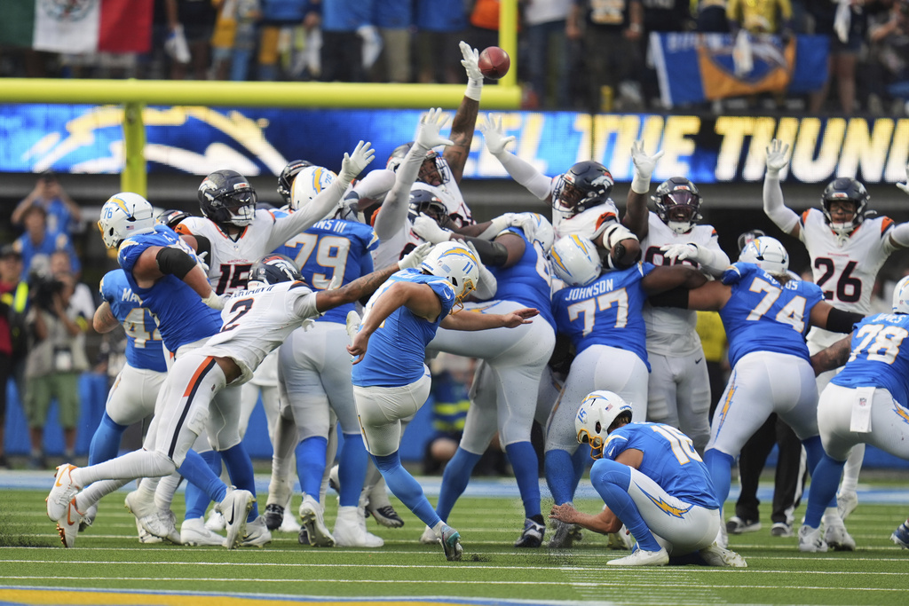 Los Angeles Chargers kicker Cameron Dicker (11) makes the game-winning field goal as time expires in an NFL football game against the Denver Broncos, Sunday, Sept. 21, 2025, in Inglewood, Calif. (AP Photo/Gregory Bull)
