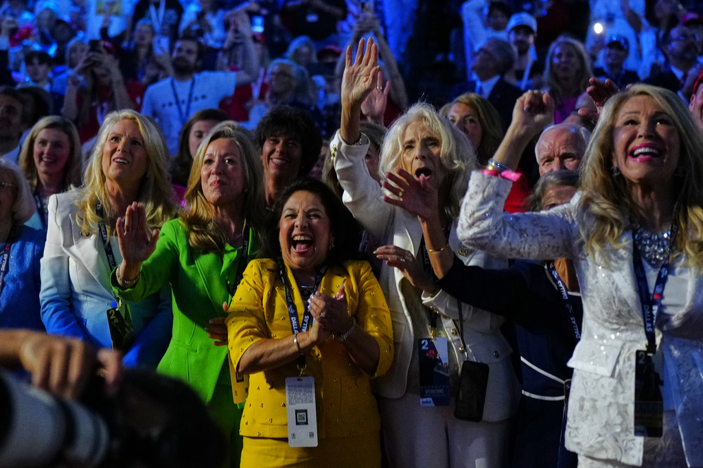 People react as President Donald Trump stands on stage at the Republican convention, Thursday, Sept. 10, 2026, in Dallas. (AP Photo/Julia Demaree Nikhinson)