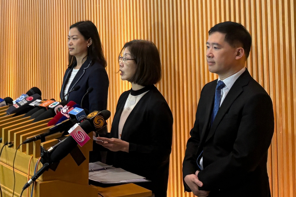 Permanent Secretary for Constitutional and Mainland Affairs Maggie Wong, from left, Secretary for Constitutional and Mainland Affairs Janice Tse, and Under Secretary for Constitutional and Mainland Affairs Clement Woo meet reporters on public consultation for Hong Kong's first five-year plan at the government headquarters in Admiralty district of Hong Kong, Monday, June 15, 2026. (AP Photo/Kanis Leung)