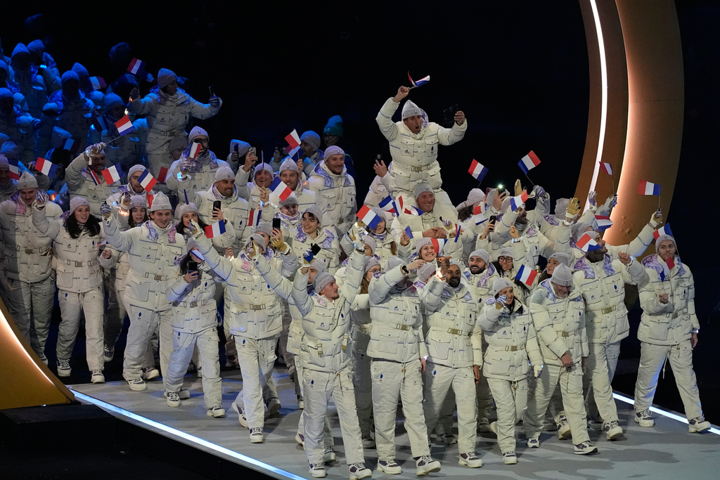 Athletes from France attend the Olympic opening ceremony at the 2026 Winter Olympics, in Milan, Italy, Friday, Feb. 6, 2026. (AP Photo/Petr David Josek)