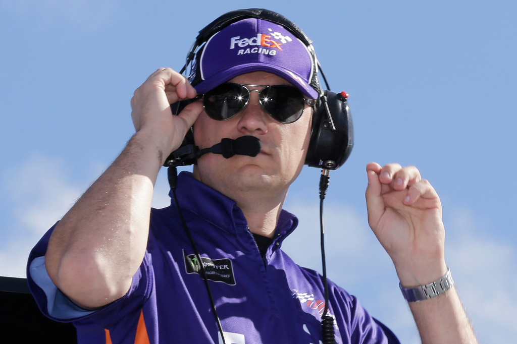 FILE - Christopher Gabehart, crew chief for Denny Hamlin, watches practice for a NASCAR Cup Series auto race on Saturday, Nov. 16, 2019, at Homestead-Miami Speedway in Homestead, Fla. (AP Photo/Terry Renna, File)