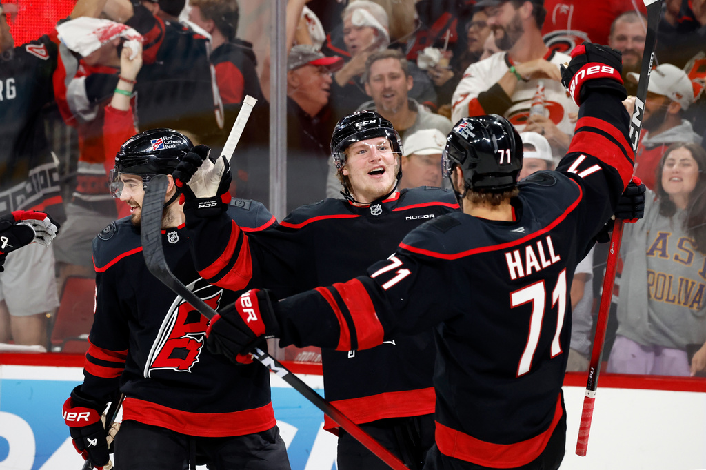 Carolina Hurricanes' Jackson Blake (53) celebrates his goal with teammate Taylor Hall (71) during the second period in Game 5 of the Eastern Conference finals NHL hockey Stanley Cup playoff series against the Montreal Canadiens in Raleigh, N.C., Friday, May 29, 2026. (AP Photo/Karl DeBlaker)