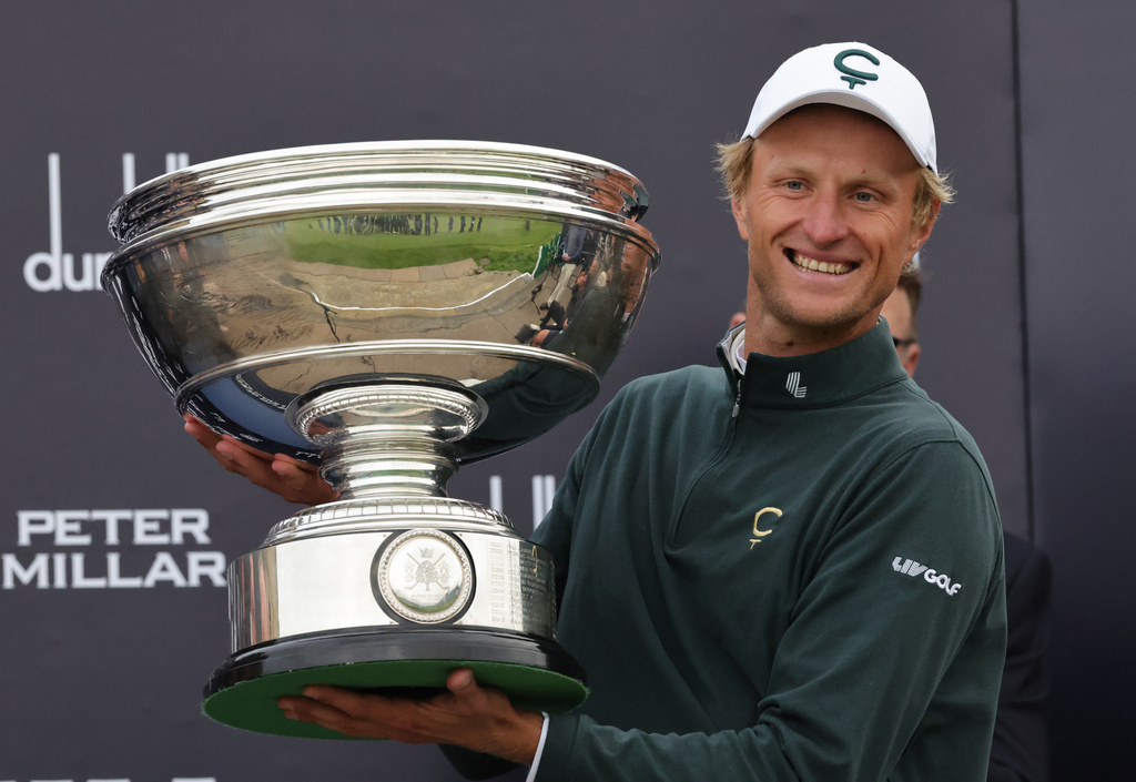 Adrian Meronk of Poland holds the trophy after winning the Alfred Dunhill Links Championship 2026 at the Old Course at St Andrews, Scotland, Sunday Oct. 4, 2026. (Steve Welsh/PA via AP)