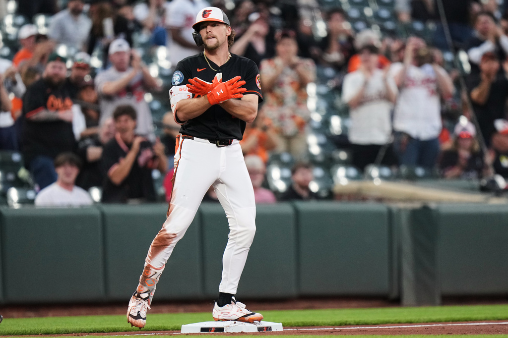 Baltimore Orioles' Gunnar Henderson celebrates after hitting an RBI triple during the third inning of a baseball game against the Arizona Diamondbacks, Monday, April 13, 2026, in Baltimore. (AP Photo/Stephanie Scarbrough)